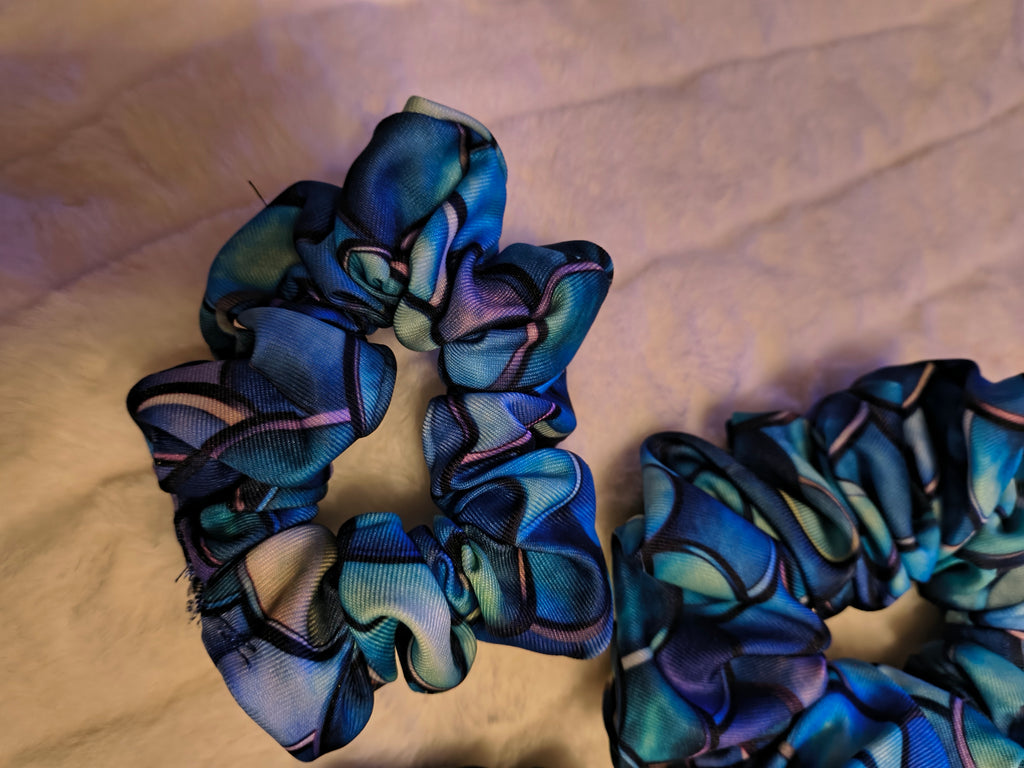 Scrunchie, hair accessory, 3 pack including a small, medium and Large scrunchie in deep blues and a variegated colors