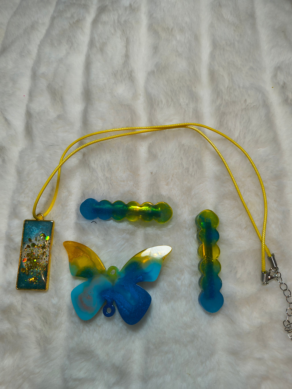 Hair Clips, Set of three clips and a necklace, all in complimentary colors, two of the clips are same style, and a butterfly