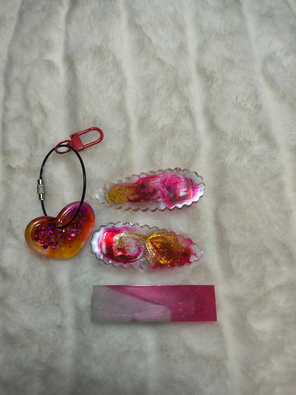 Hair Clips, three hair clips in beautiful pinks and gold.  Two match in style and color, with a heart shaped Keychain in a sparkles, all are resin