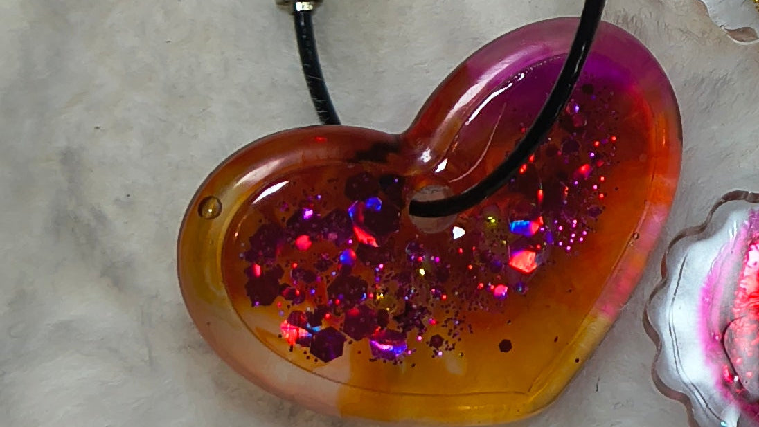 Hair Clips, three hair clips in beautiful pinks and gold.  Two match in style and color, with a heart shaped Keychain in a sparkles, all are resin