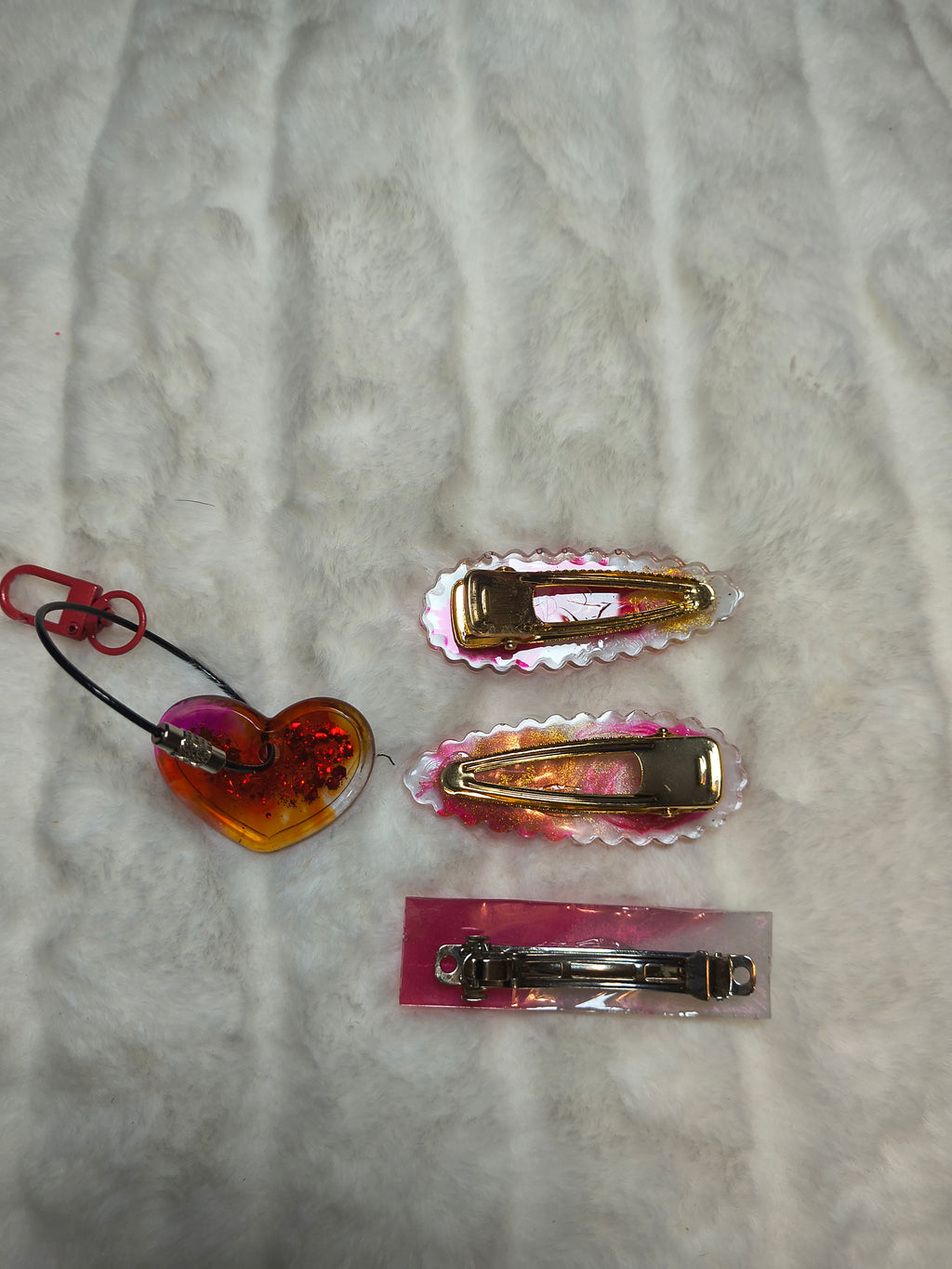 Hair Clips, three hair clips in beautiful pinks and gold.  Two match in style and color, with a heart shaped Keychain in a sparkles, all are resin