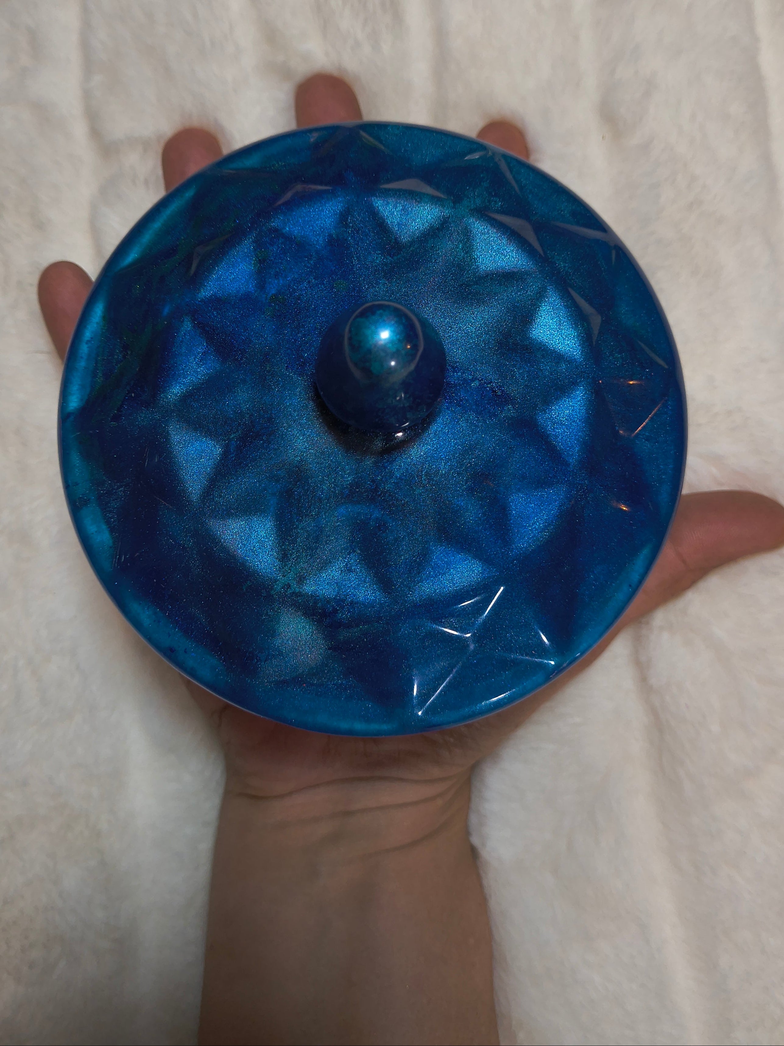 Blue option in hand and up close
