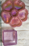 Trinket trays, one an organizer with several hearts.  See the sparkle and shimmer of several colors. The a small lighter pink holder that will sparkle forever