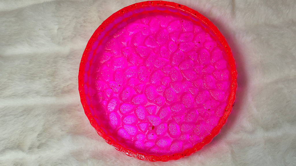 Up close visual of the eye catching neon pink holder