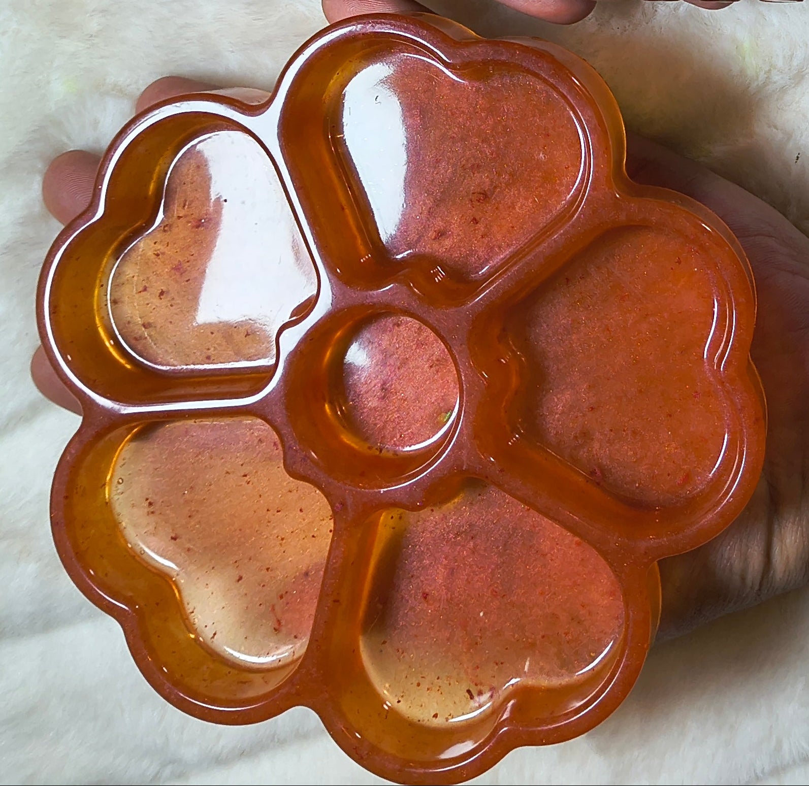 Close up of heart organizer in off orange that shimmers