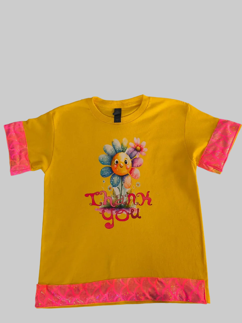 Short sleeve T-shirt,  Yellow , Trimmed in a multi color edging  that  has "Thank You" on the graphics