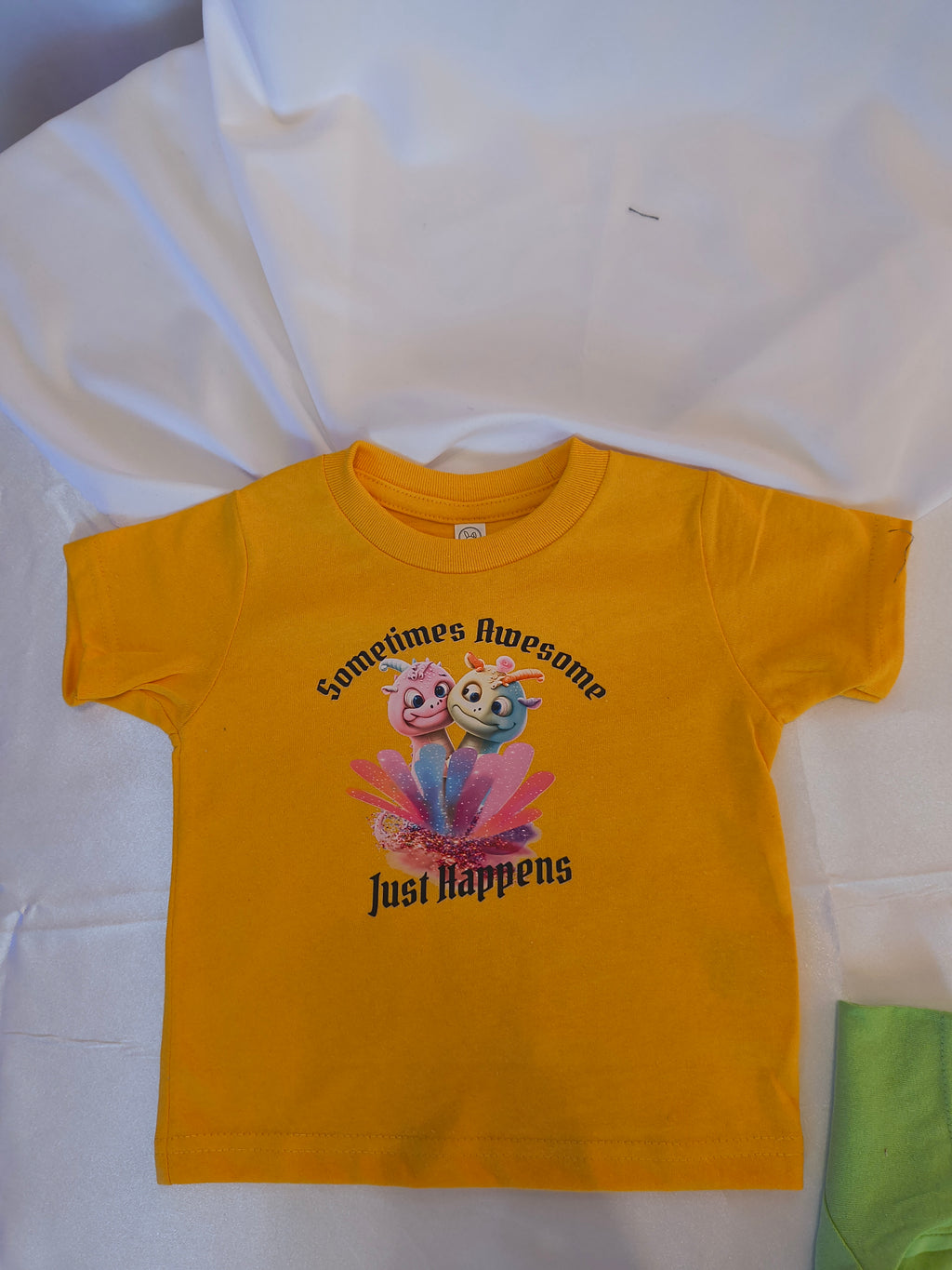 Short Sleeve T-Shirt, Yellow 100%cotton, Goofy Characters with variegated colors, States "Sometimes Awesome Just Happens"