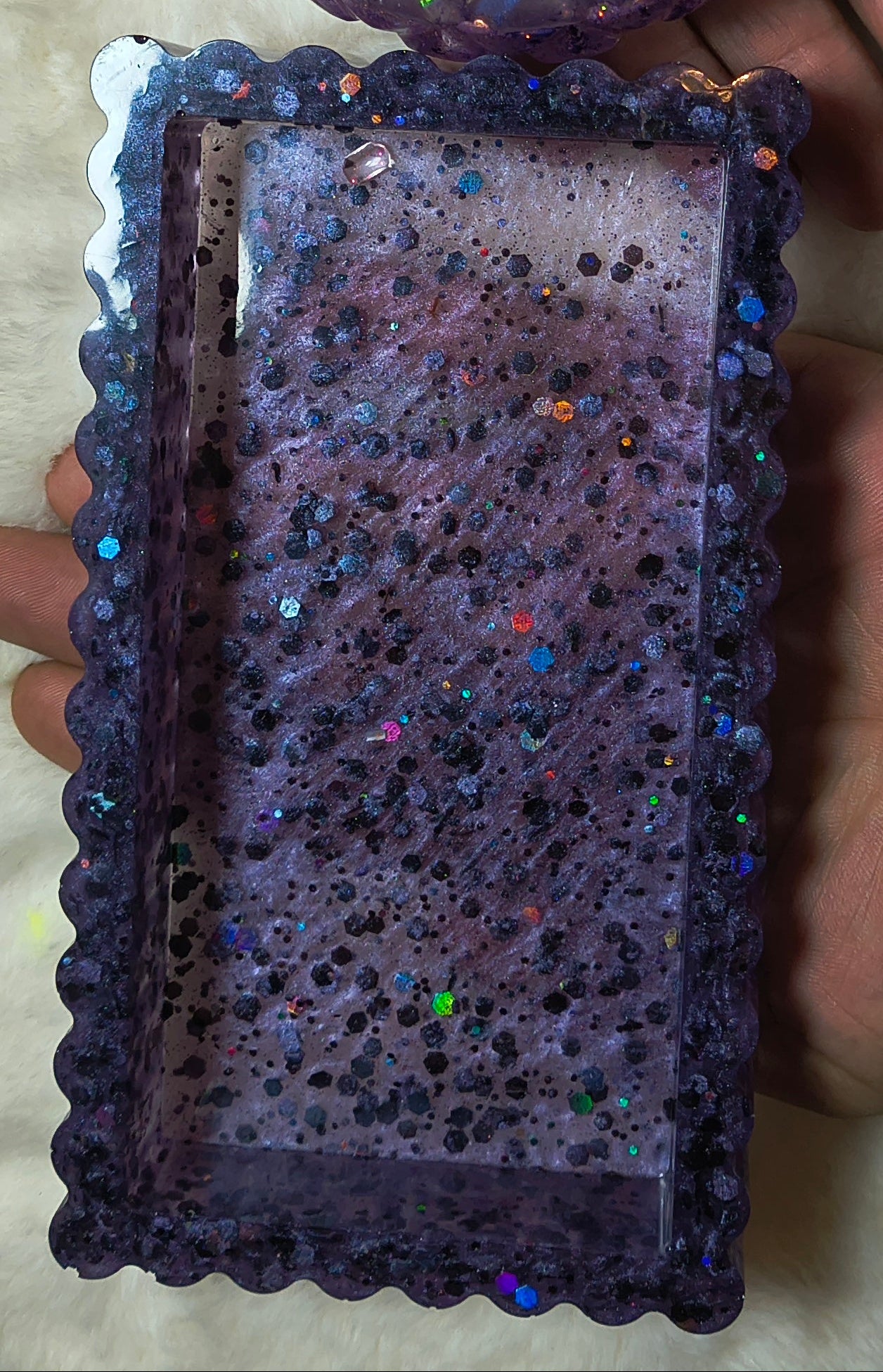 Close up of tray, rectangle in variegated sparkling purples and other glimpses of colors