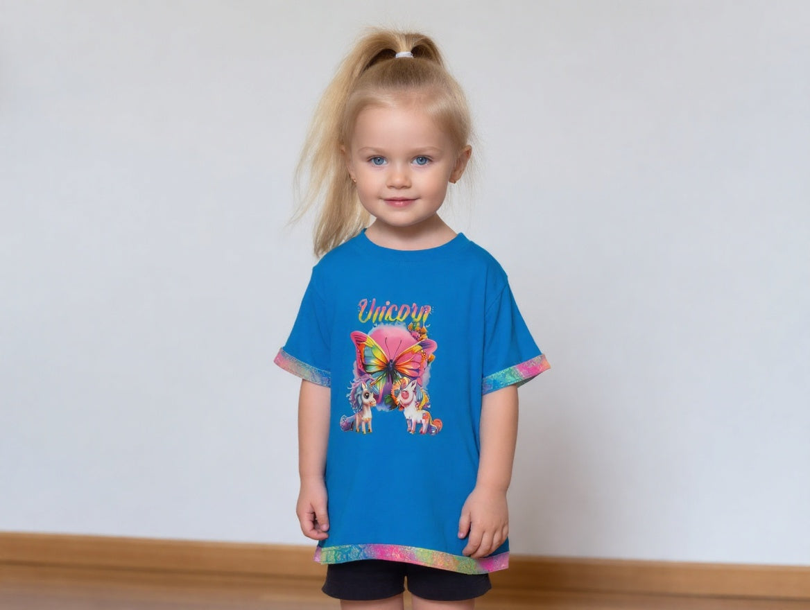 Short Sleeve T-Shirt, Turquise, 100% cotton. Unicorns and Butterfly graphic with a multicolor fabric trim that sparkles around sleeves and bottom of shirt